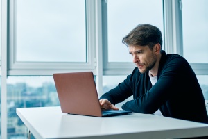 men looking on his computer