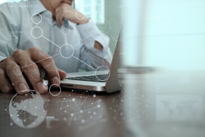 person looking online using FedRAMP compliance services