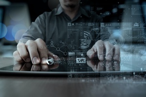 man using tablet for CMMC level 4 compliance