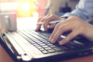 close up of computer for FedRAMP compliance services