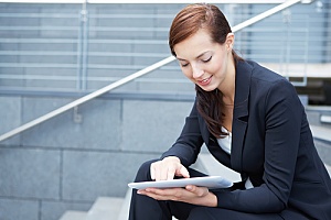 a business woman reading an eBook about disaster recovery