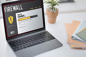 a laptop running firewall software from outsourced it help desk services