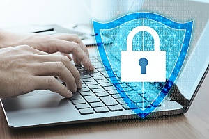 a person working securely on a laptop because of managed it services and it security in new jersey