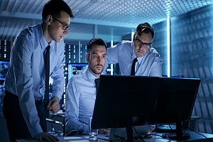 a security operations center team performing routine tests on a network