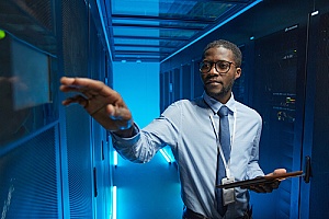 a server maintenance specialist working in a server room