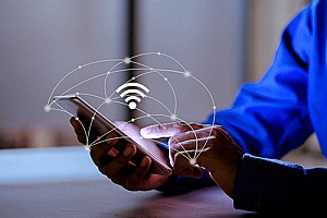 an employee enjoying the internet connection after a commercial wifi installation