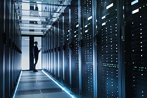 an employee working in a data center to maintain its servers