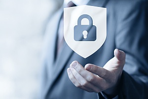 business man holding a lock logo in the palm of his hand representing effective it security services