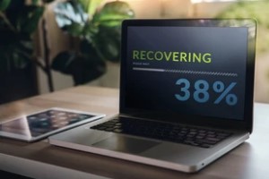 Laptop Displaying the Recovering Process Bar