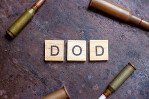 dod sign with bullets on rusty metal background