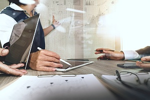 Employees working with a board
