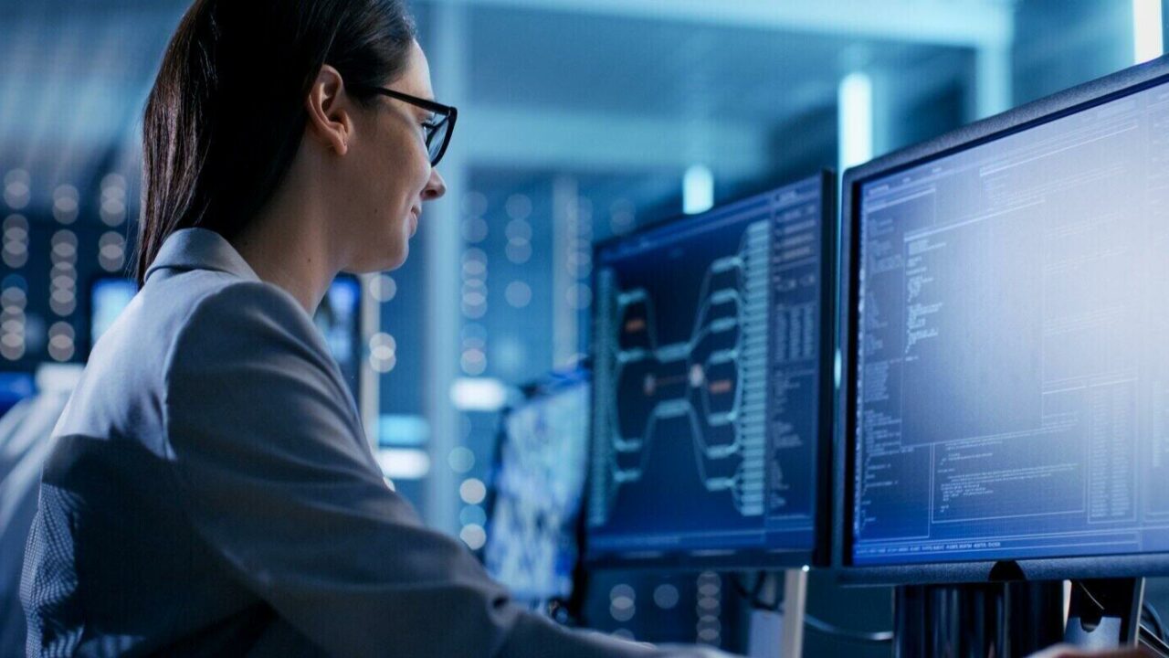 female it engineer working in monitoring room