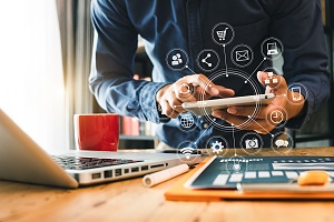 financial industry businessman working on a tablet communicating with clients