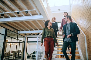Group of happy employees on stairs