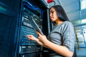 IT auditor inspects the server to verify if it meeting IT security compliance