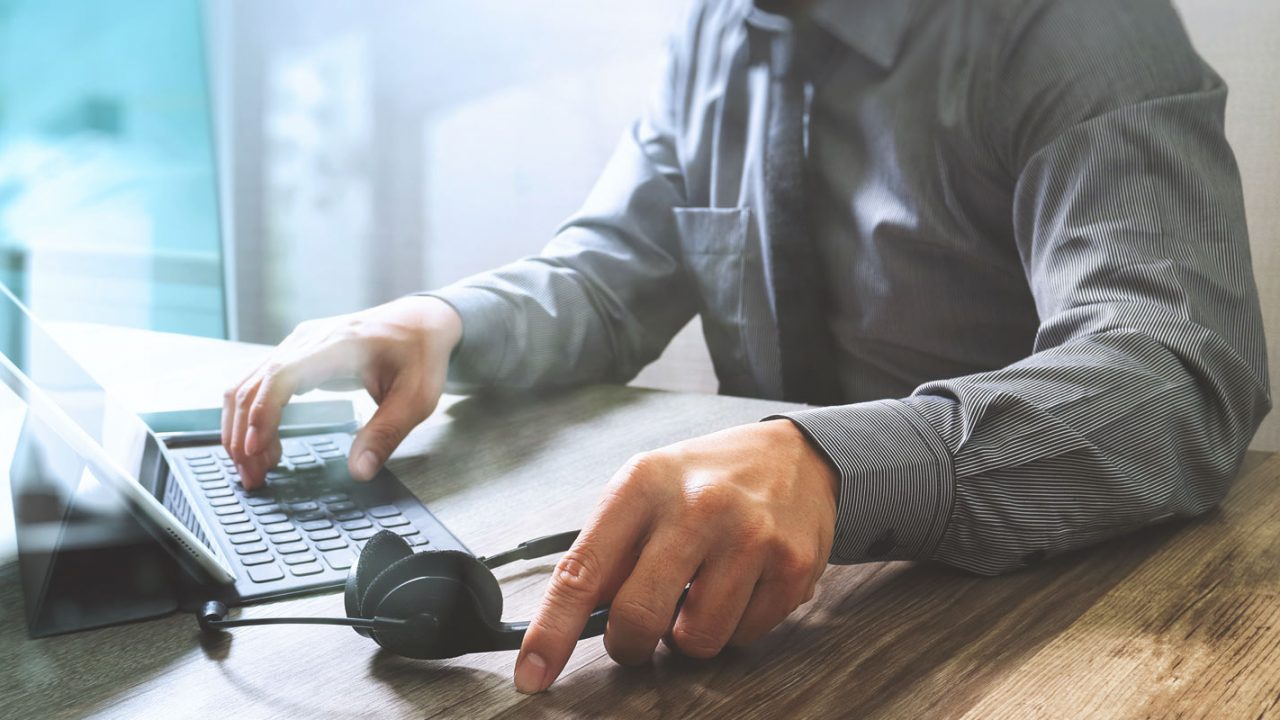 IT help desk employee at table
