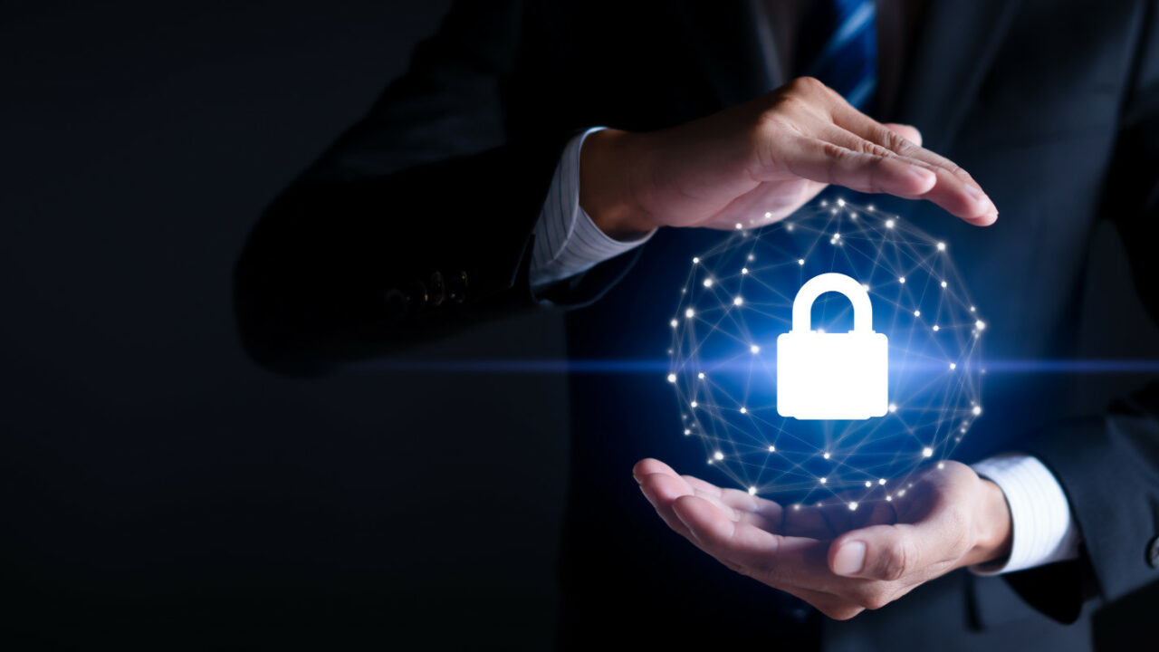 IT professional separate hands to demonstrate process of IT security compliance
