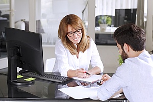 IT specialist walking. client through process