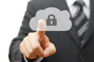 man pointing to a cloud with a lock in it representing it security compliance in cloud services