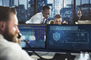 it security professionals providing assistance to a new jersey business in a large room with computers