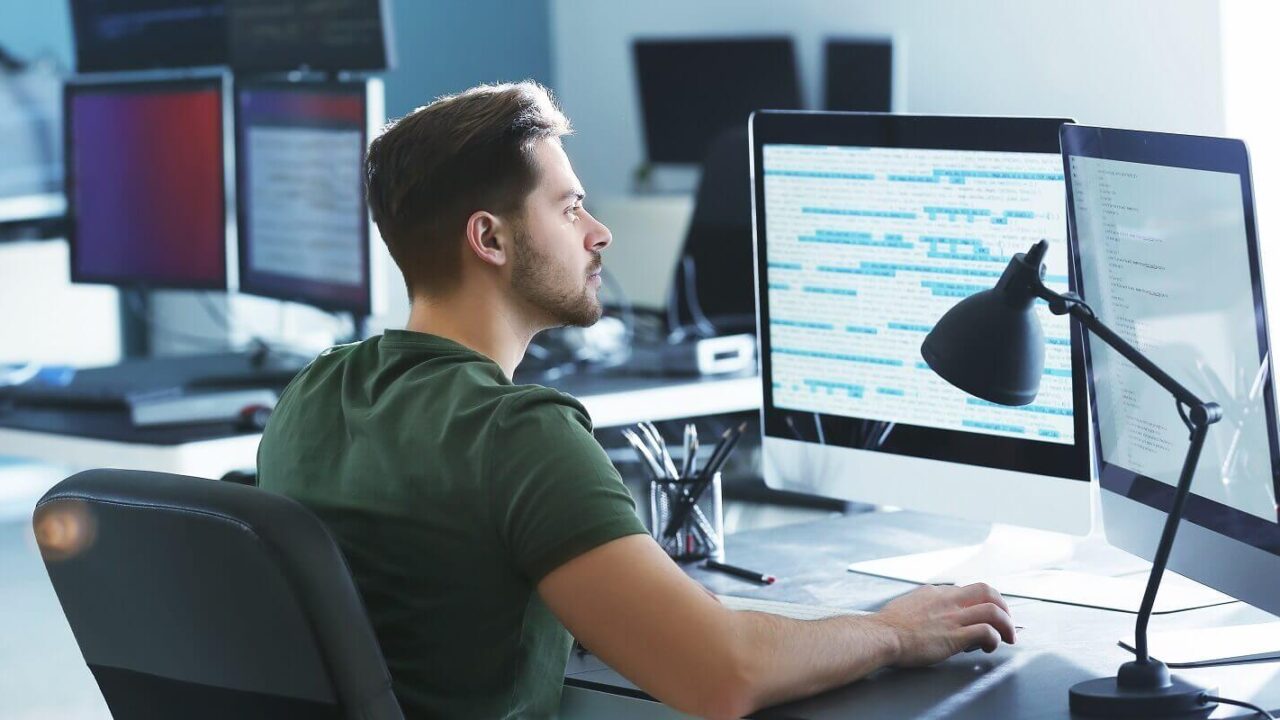 male programmer working in office