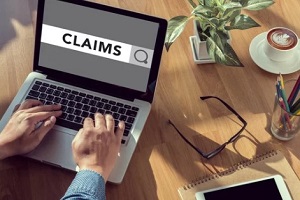 man checking claim status online