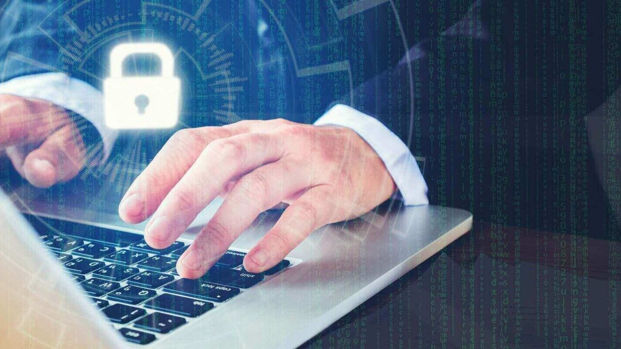 man hand using laptop with cyber security job business and network server concept