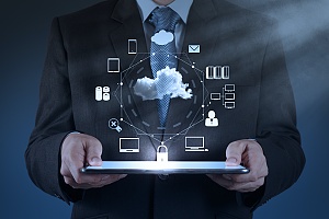 man holding a tablet showing the different nyc it cloud services available