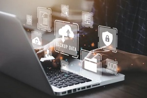man retreiving backup data in laptop