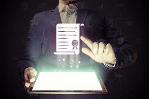 a businessman holding a tablet projecting a document