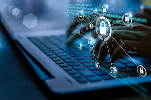 man working on a laptop on a secure network 