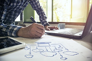 Man working on computer cloud work