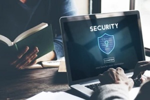 man working on secure laptop