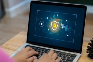 man working on secured laptop
