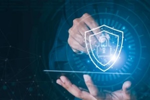 man working on tablet with cybersecurity concept
