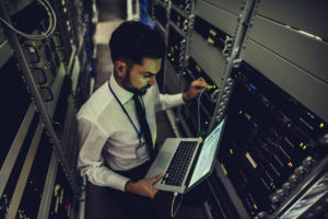 managed IT services consultant configures the server with the computer