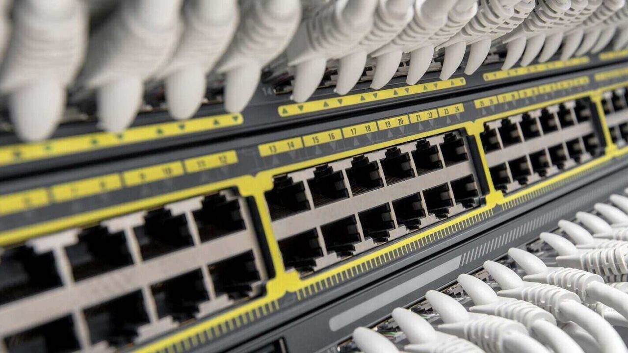 network gigabit smart switch with network cables installed in the rack