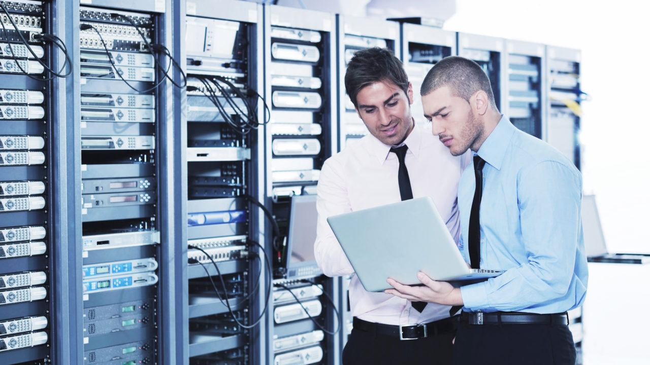 Employees of a managed IT services provider checking out the network