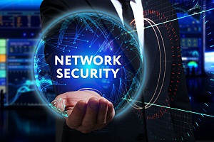 person holding the words it network security in the palm of his hands