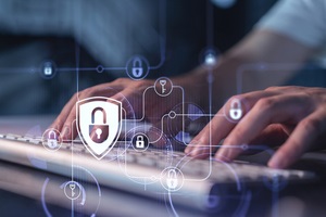 programmer is typing a code on a keyboard to protect a cyber security from hacker attacks and save clients confidential data