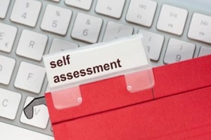 self assessment file on keyboard