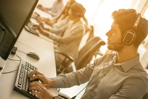 support staff speaking with head set in modern office