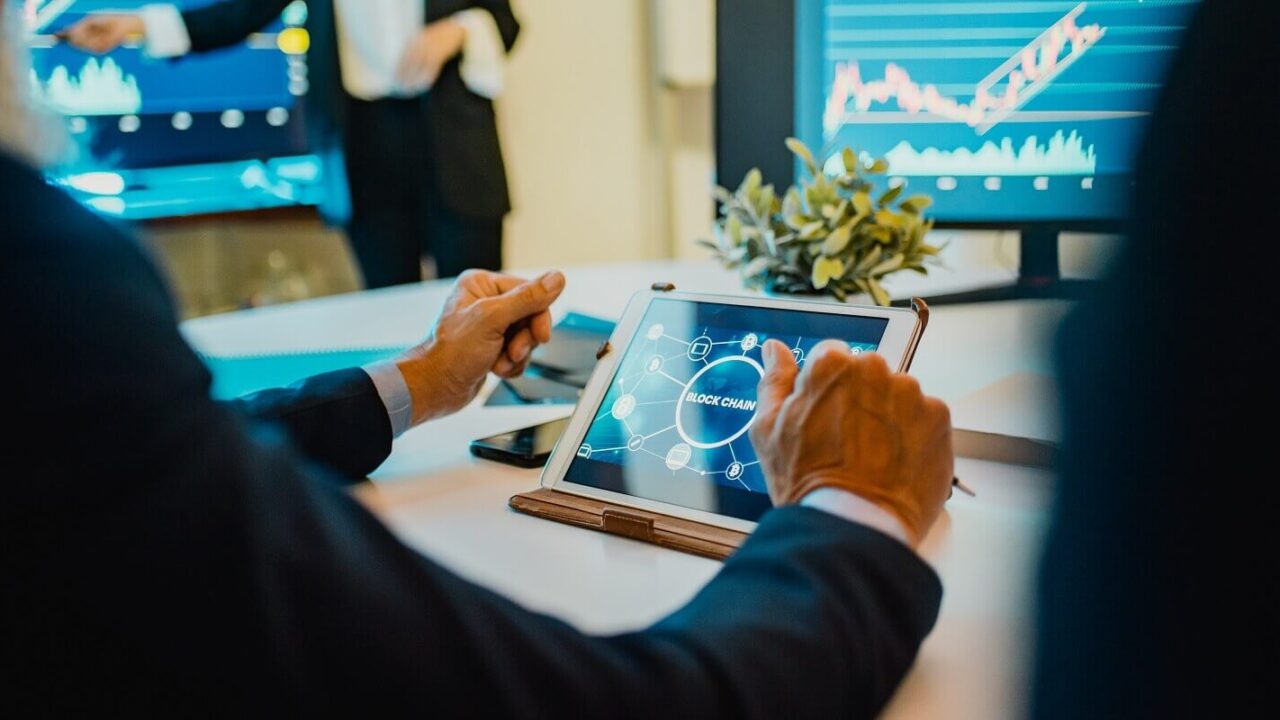 trader team doing blockchain research inside hedge fund office