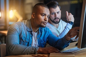 two federal employees learning the cmmc security process
