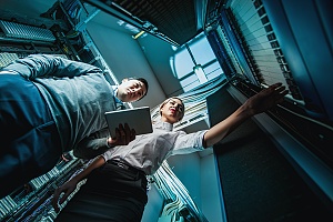 two managed it services professionals helping a business in queens new york