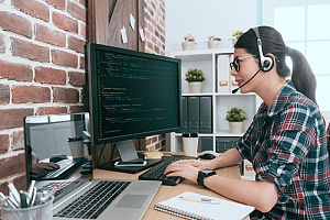 woman working remotely on her computer at a small business in NYC
