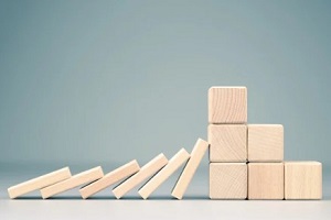wooden blocks falling concept