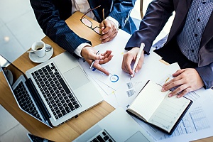 Employees working together at desk